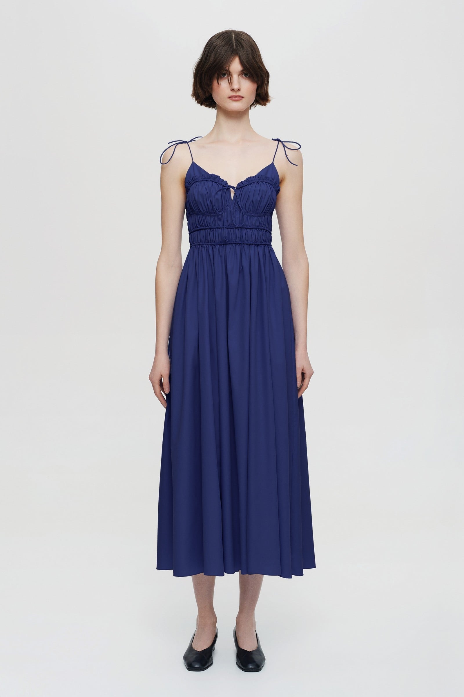 Model in pleated top midi Irresistible Flow dress front view