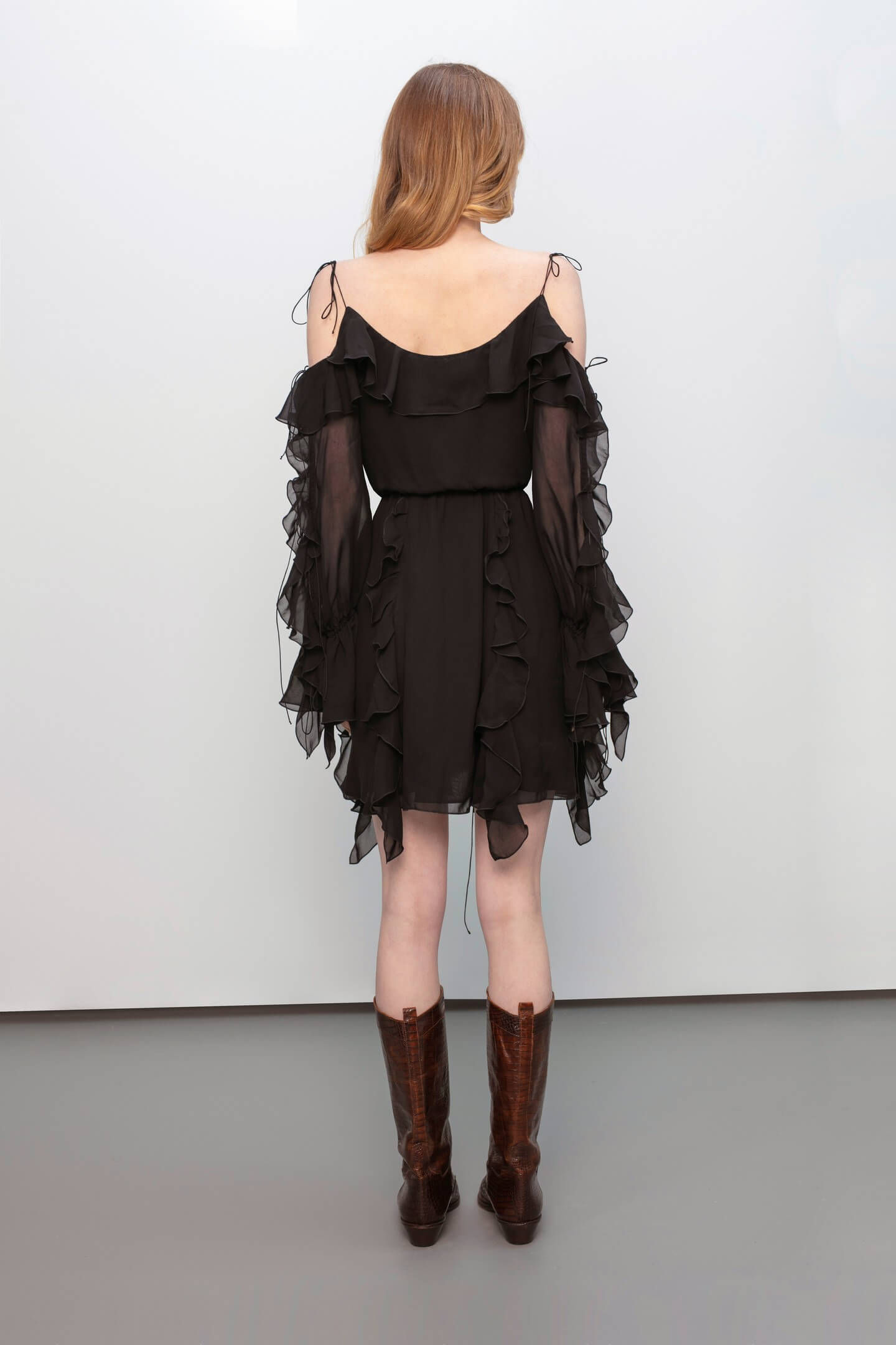 Model in Model in Morning Forest black mini dress back view