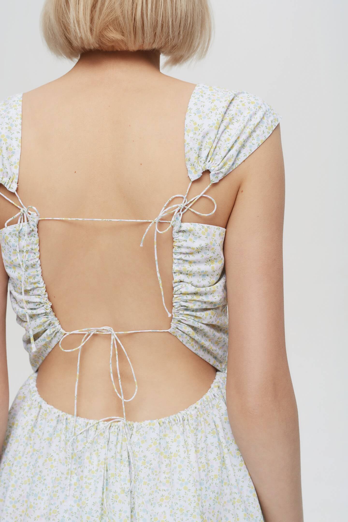 Model in Song of the Winds dress back view detail