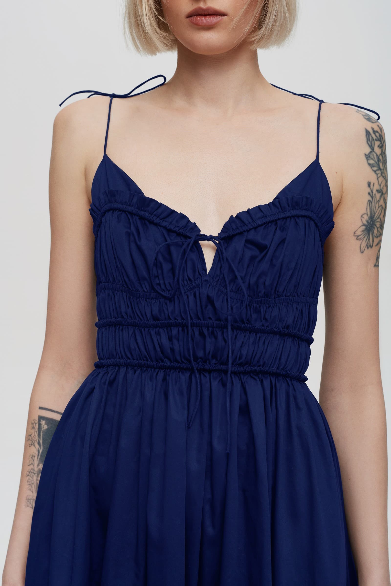 Model in pleated top midi Irresistible Flow dress front details view