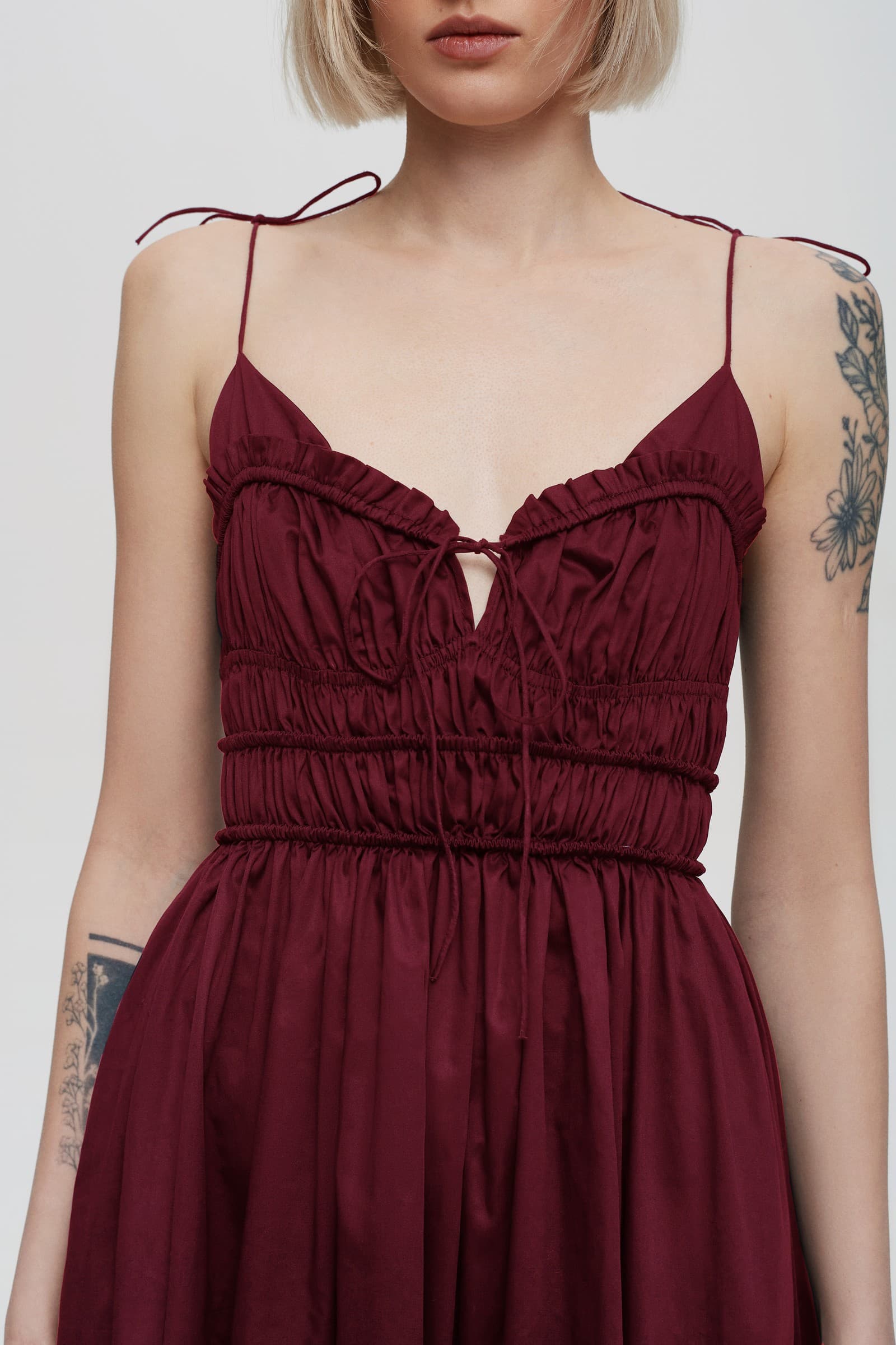 Model in pleated top midi Irresistible Flow dress front details view